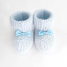 Dojčenské pletené capáčky s mašličkou modré