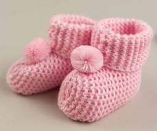 Scarpine in maglia con pompon per neonato rosa