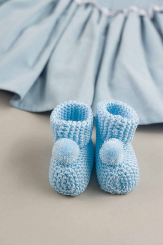 Scarpine in maglia con pompon per neonato blu
